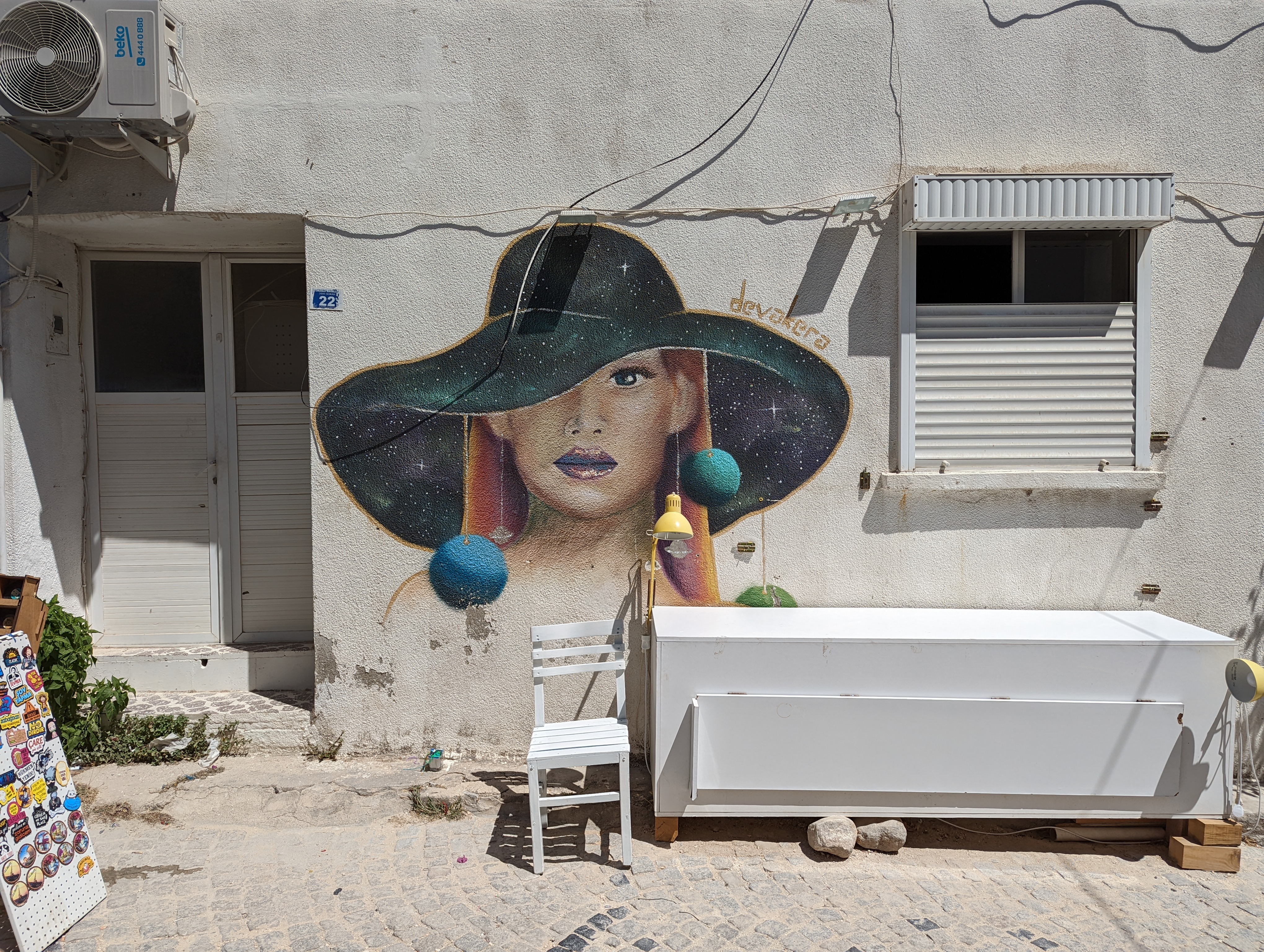 Woman in hat street art