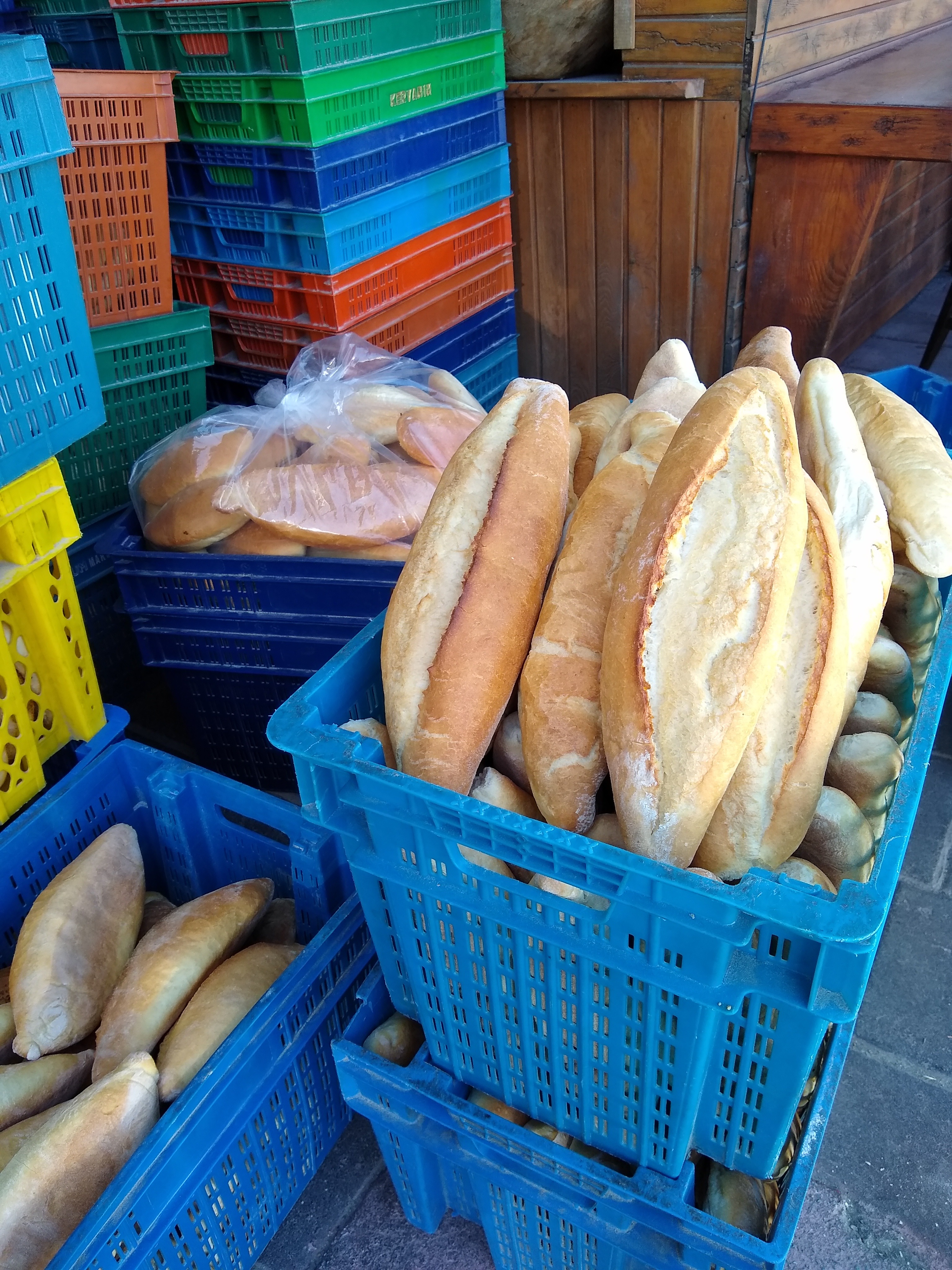 Crates of bread awaiting pickup from the bakery