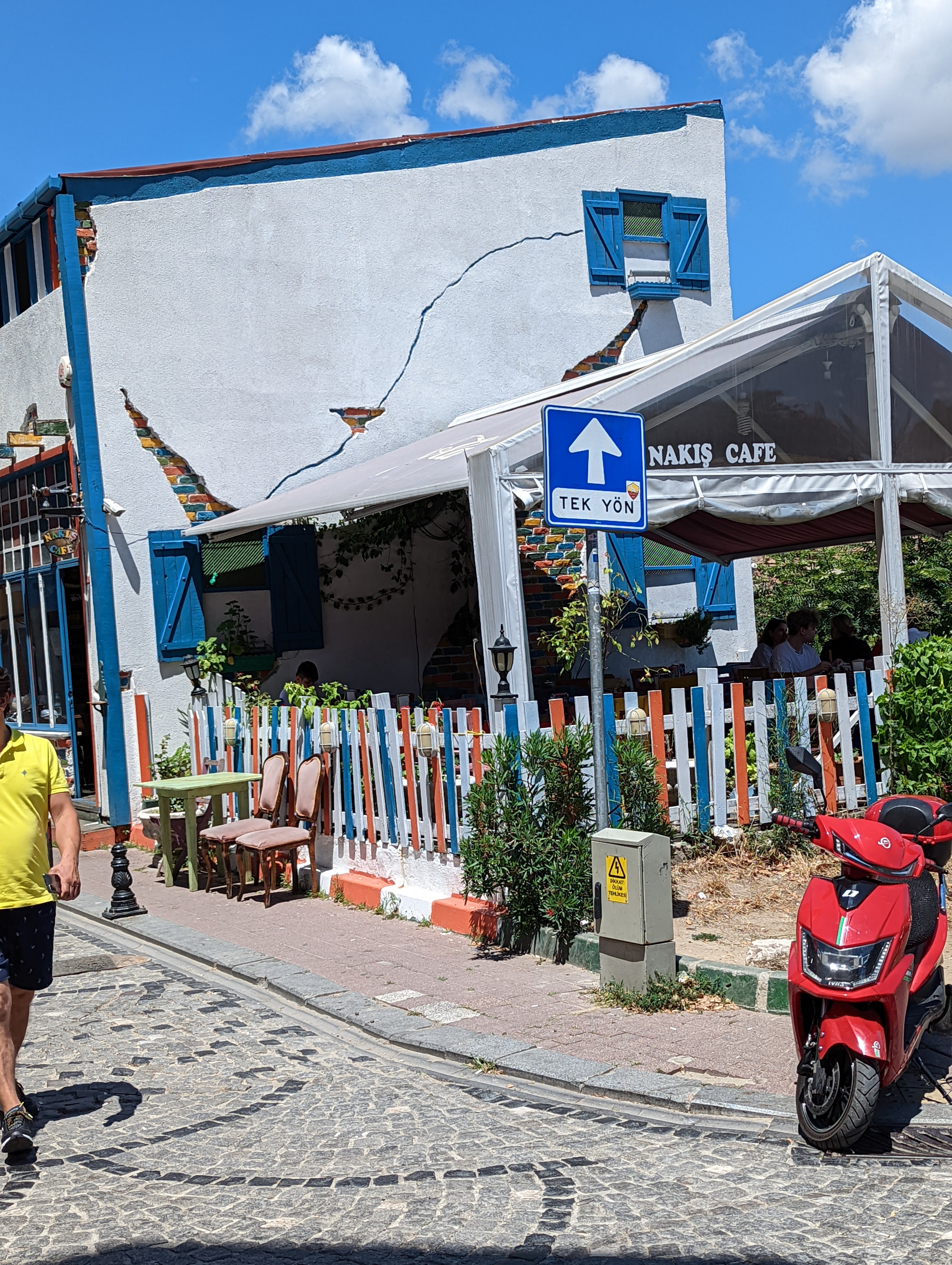 Colorful fences and wall cracks in Istanbul's Balat neighborhood.
