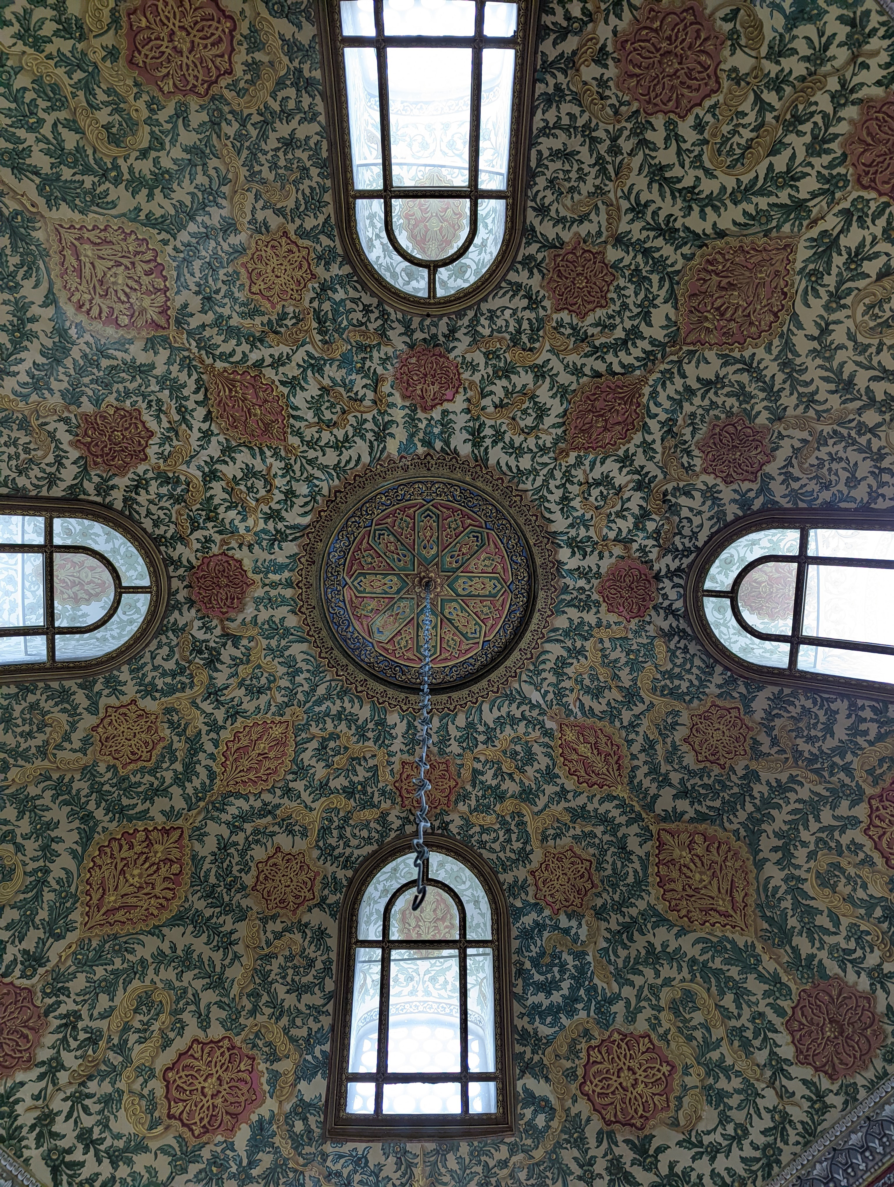 This is the interior view looking up into the central dome of the Library of Sultan Ahmed III (III. Ahmed Kütüphanesi / Enderûn Kütüphanesi), situated directly in the center of the Third Courtyard (Enderun).