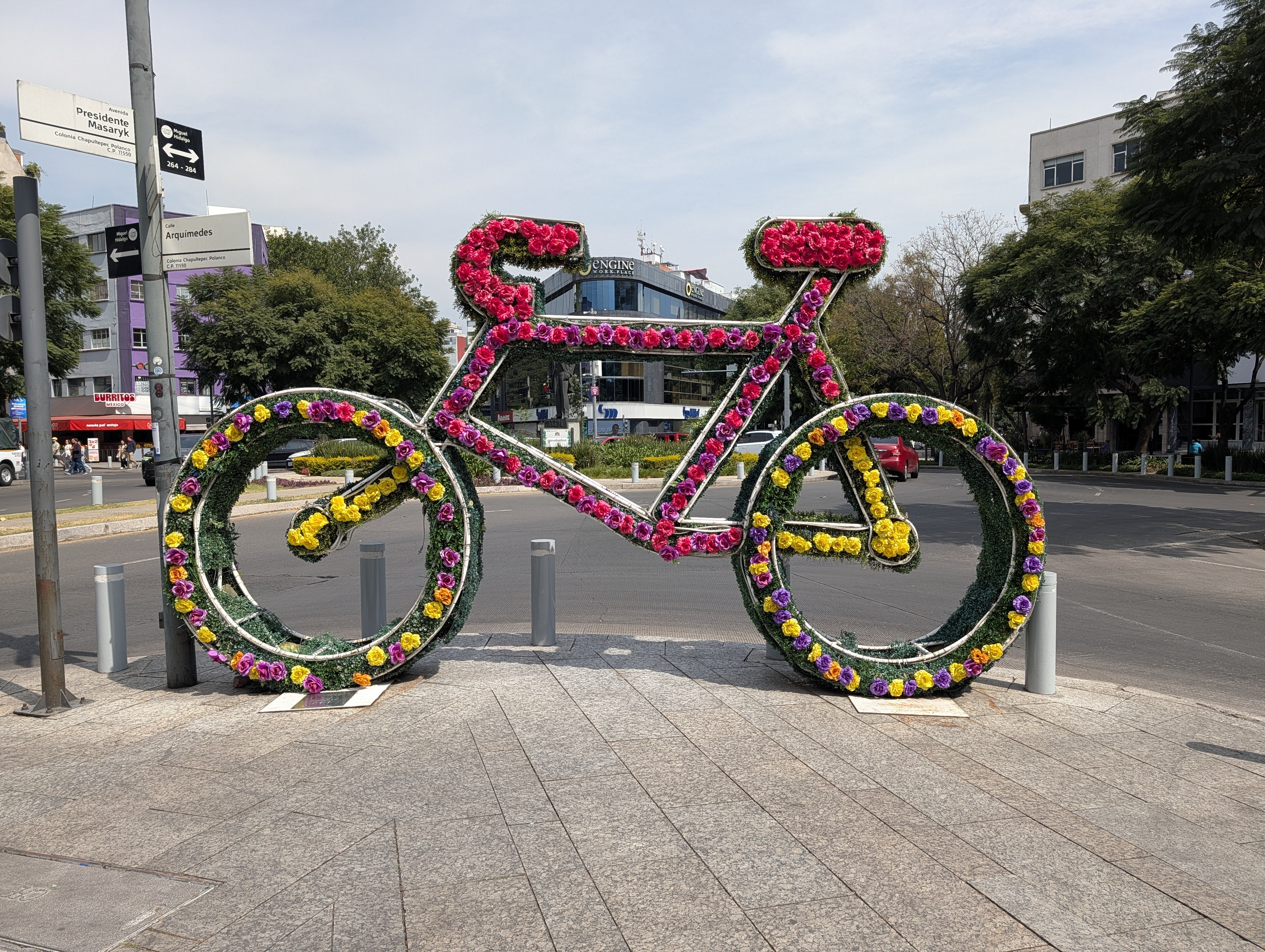 Flower-decorated bicycle sculpture