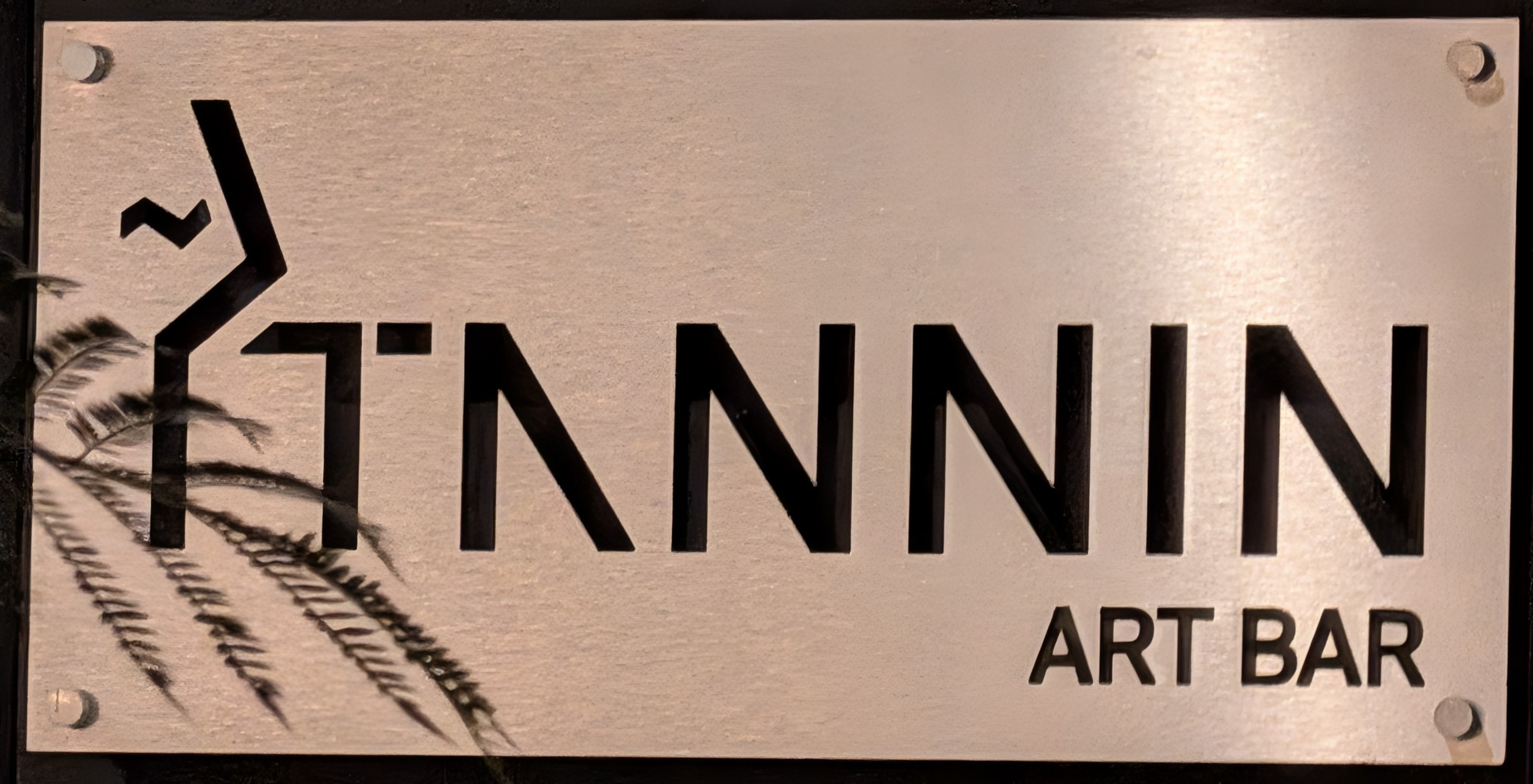 The sign for the Tannin Art Bar