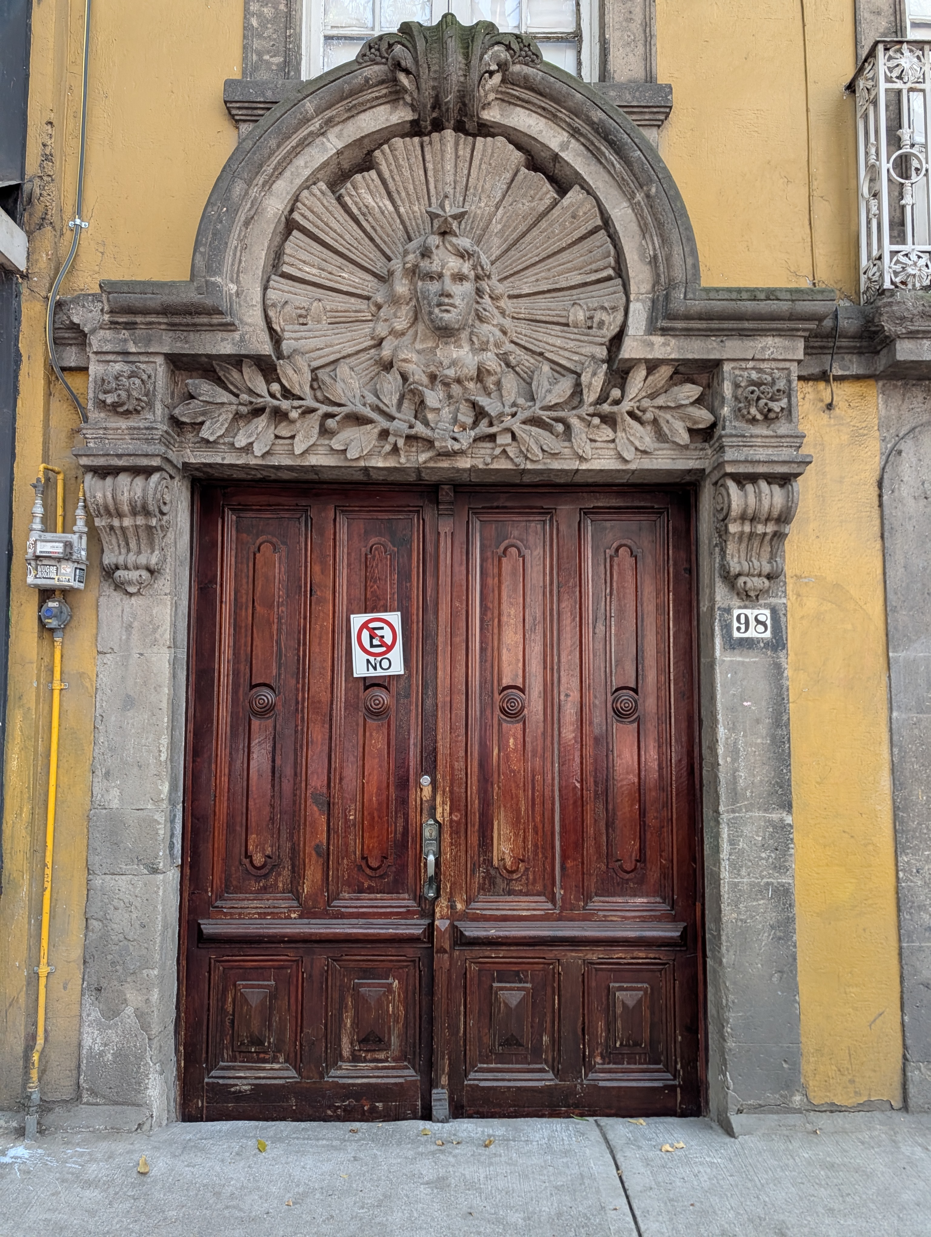Doorway with ornate sculptural lintel