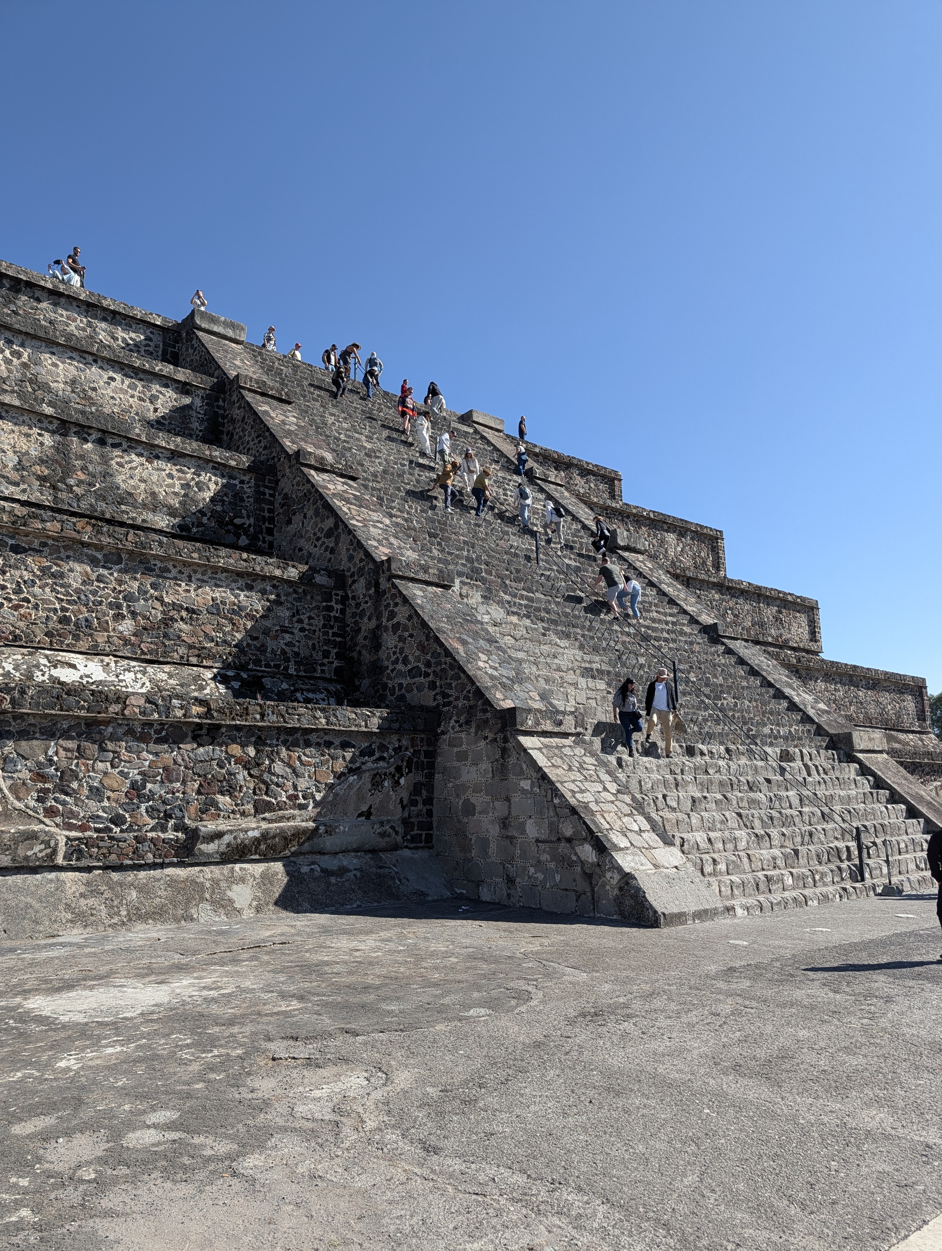 People climbing the Moon Pyramid.