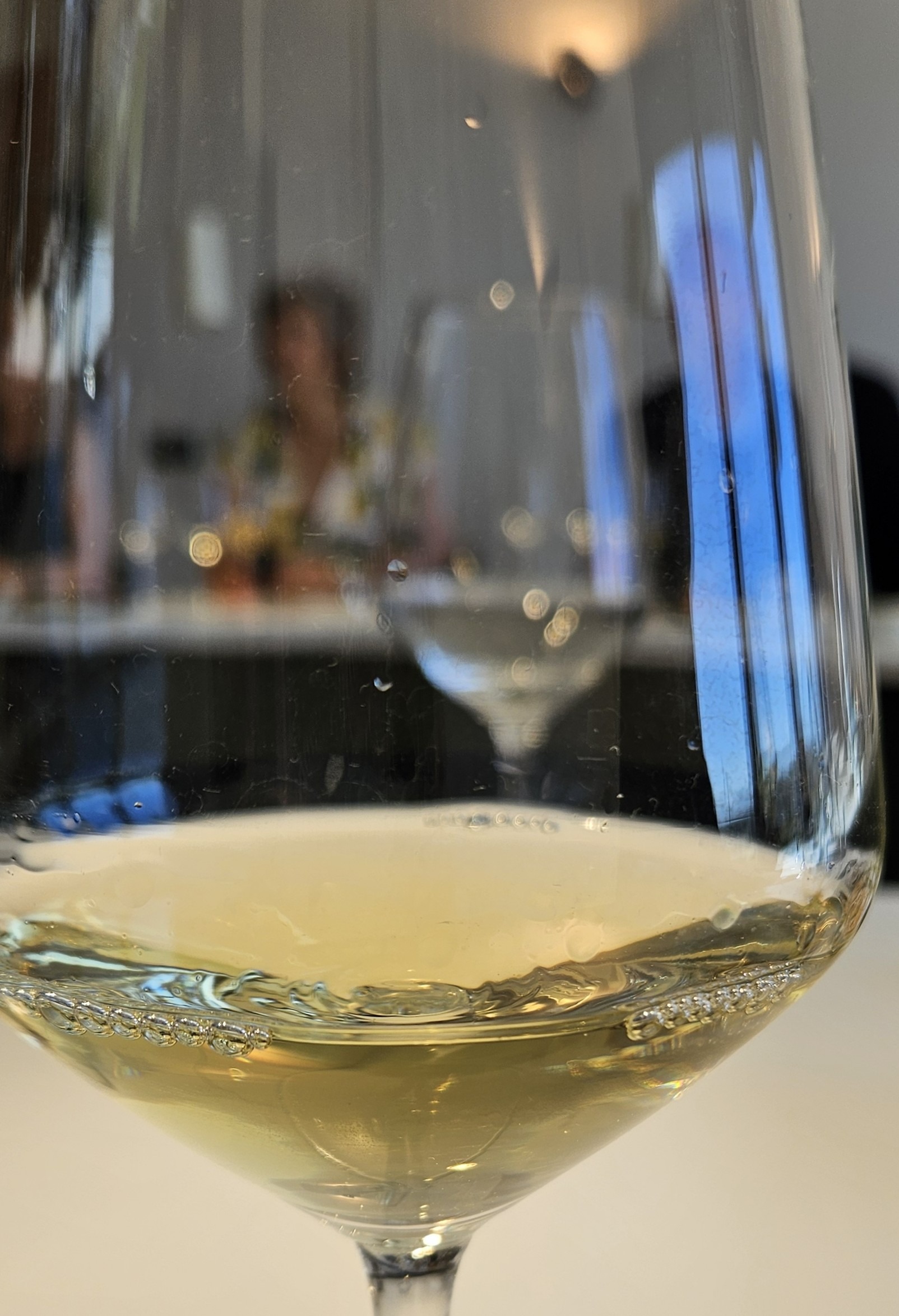Up-close wine glass with white wine