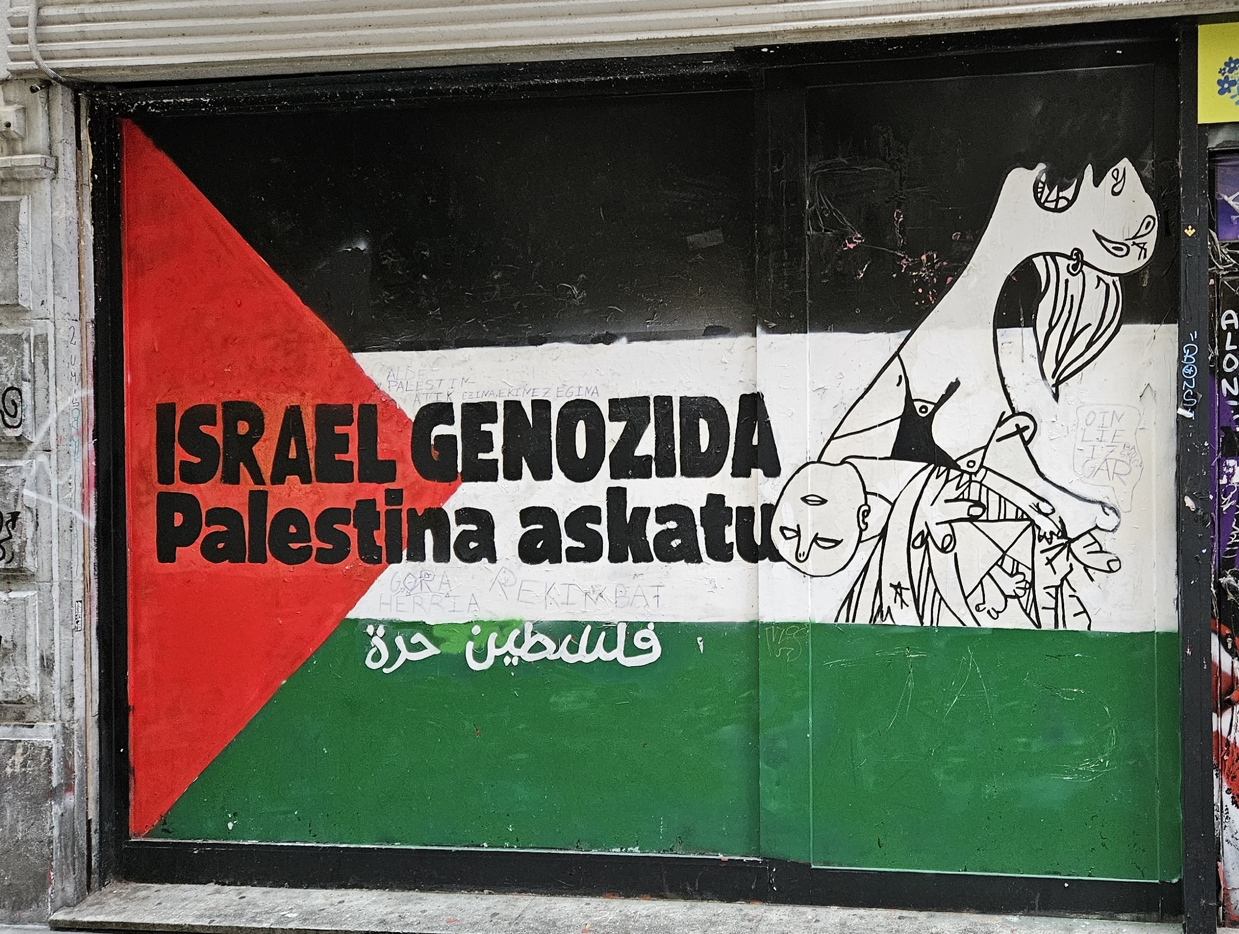 Street art showing support for Palestine featuring a snippet from Picasso's Guernica