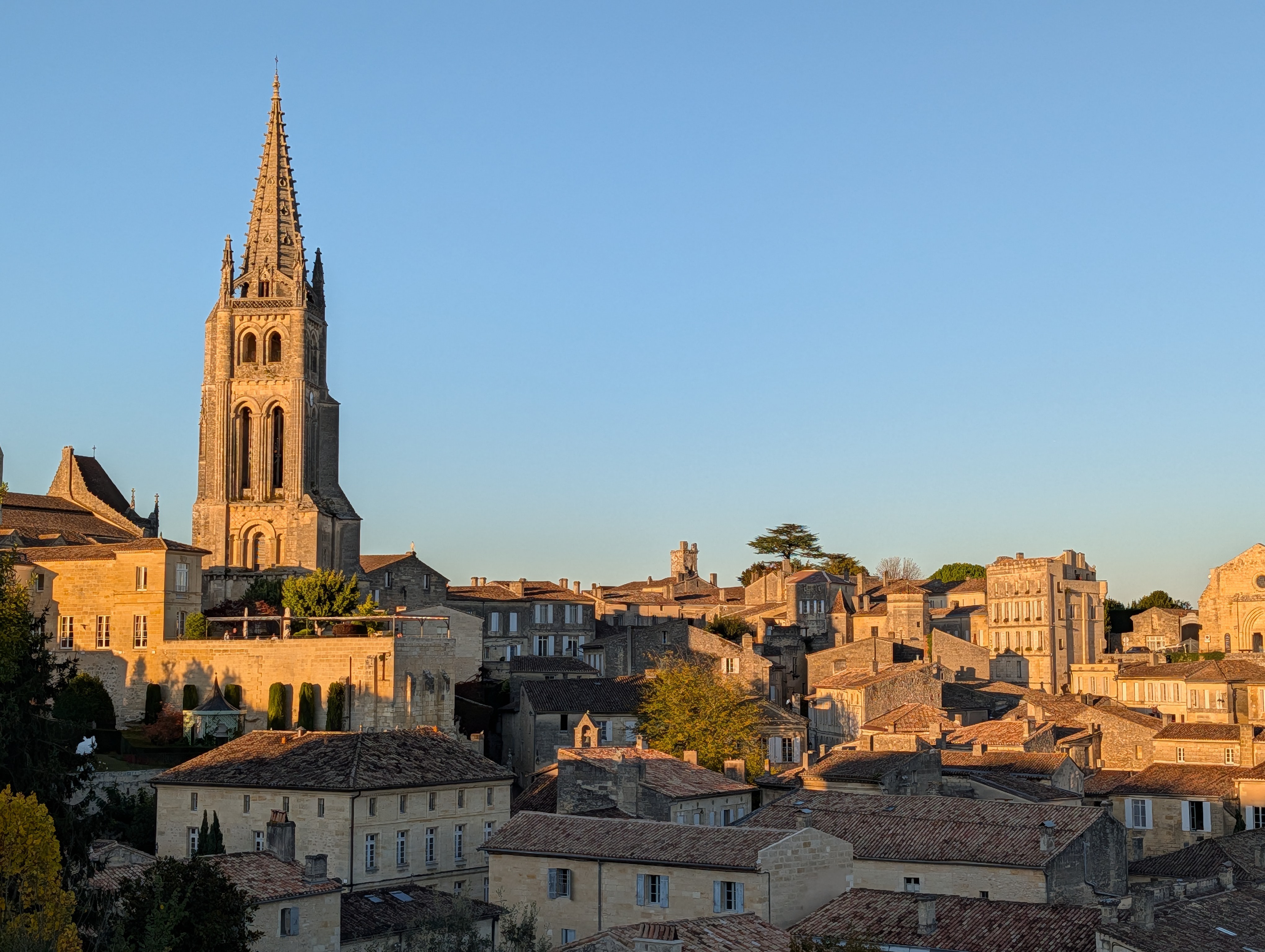 Golden hour view of town and monolithic church spire