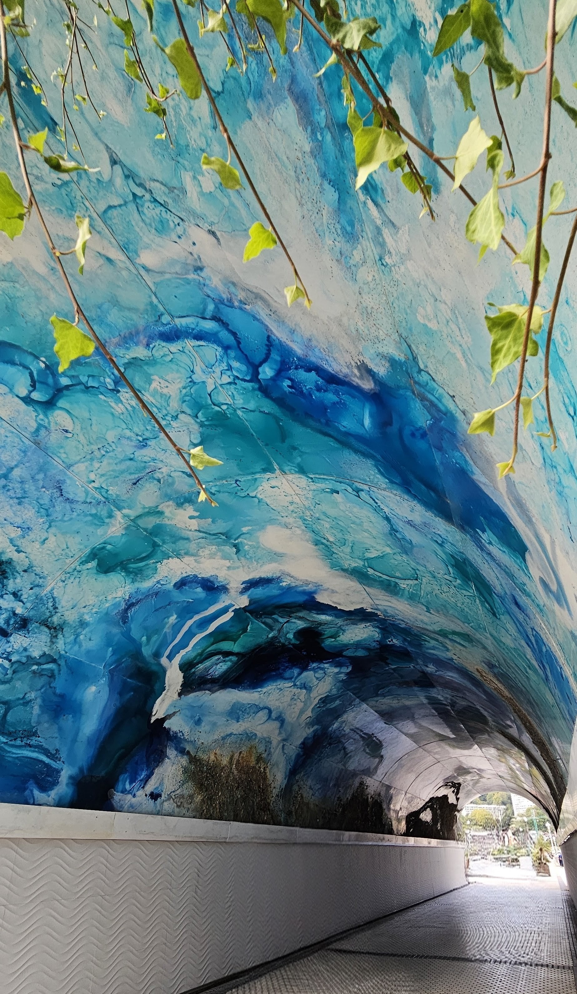 Glazed art ocean scene roofing a roadway underpass
