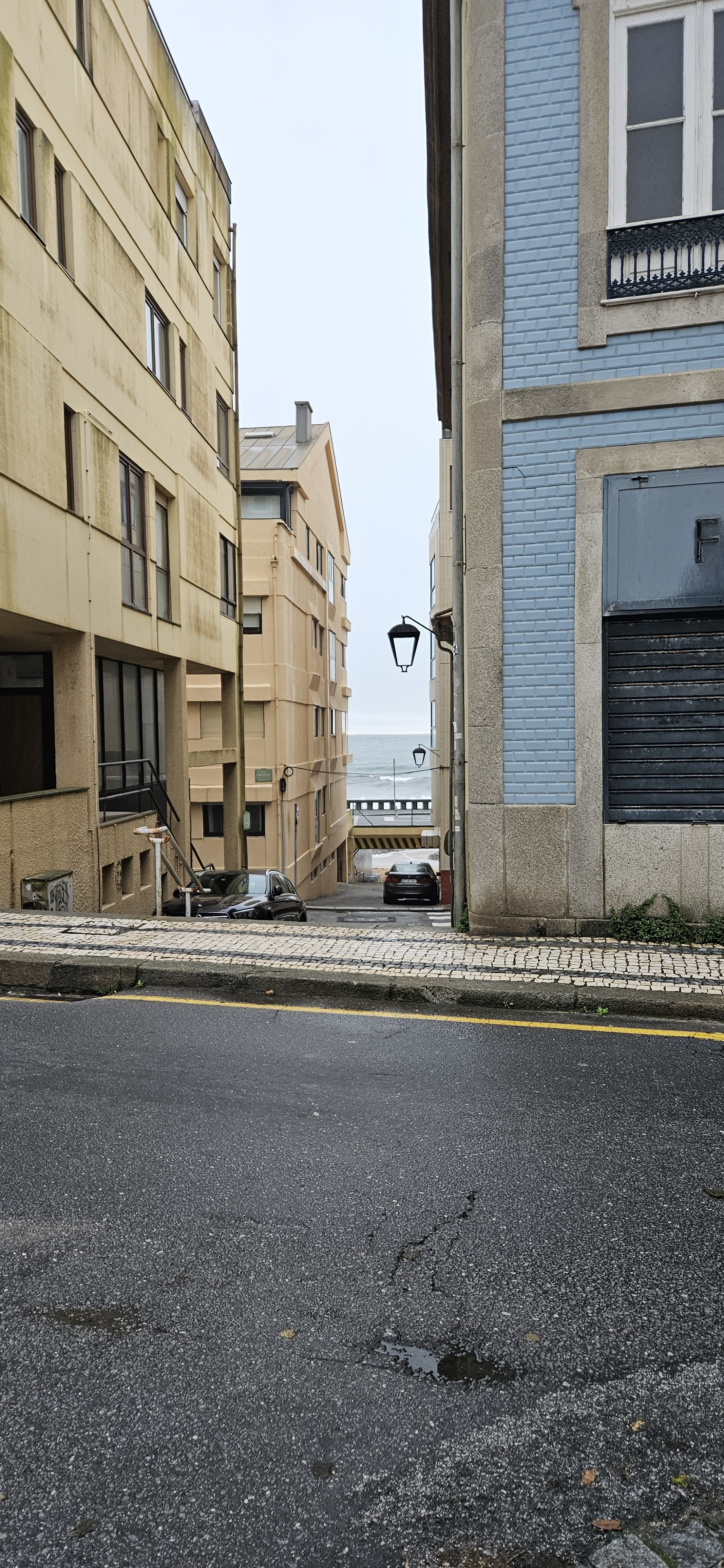 Beach seen through buildings in the Foz District