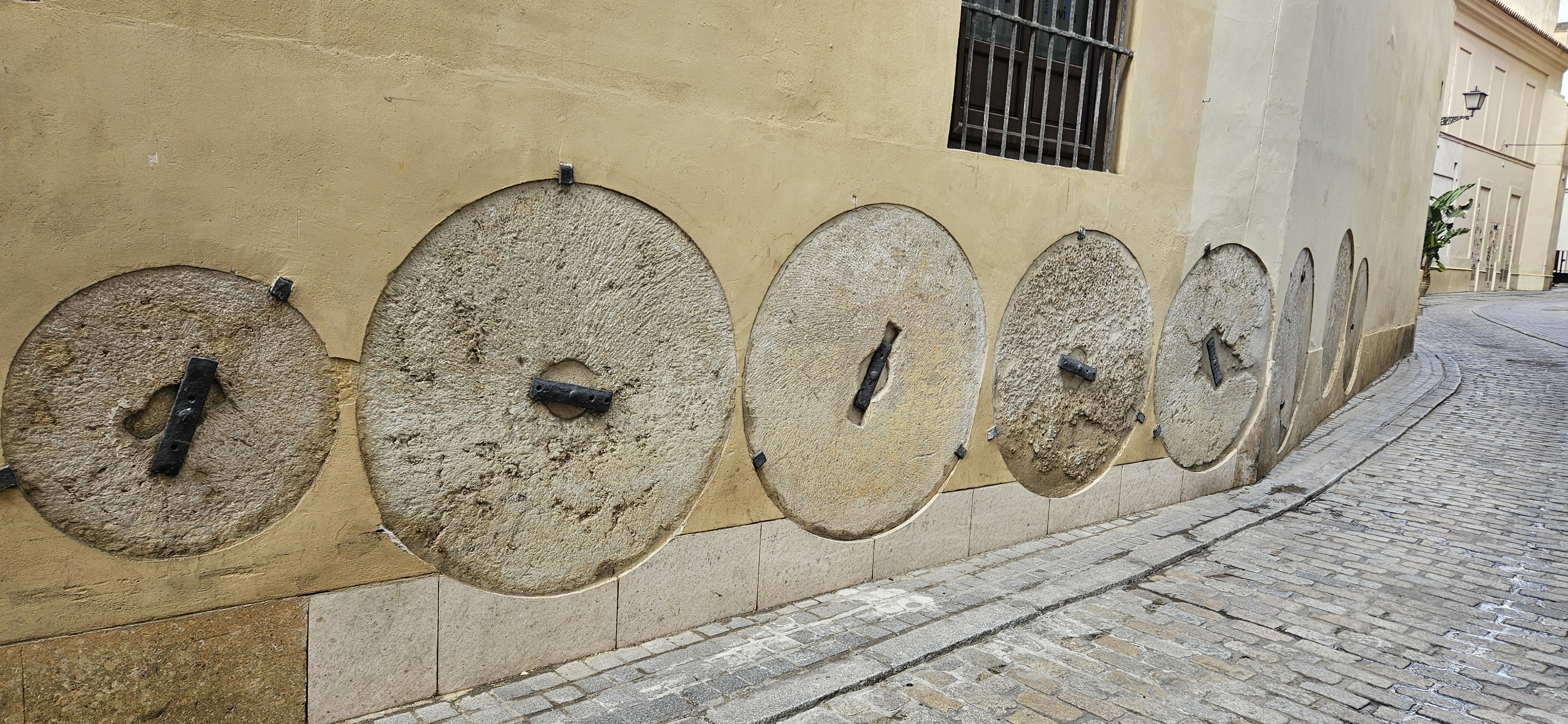 Millstones in the wall of the Archbishops palace