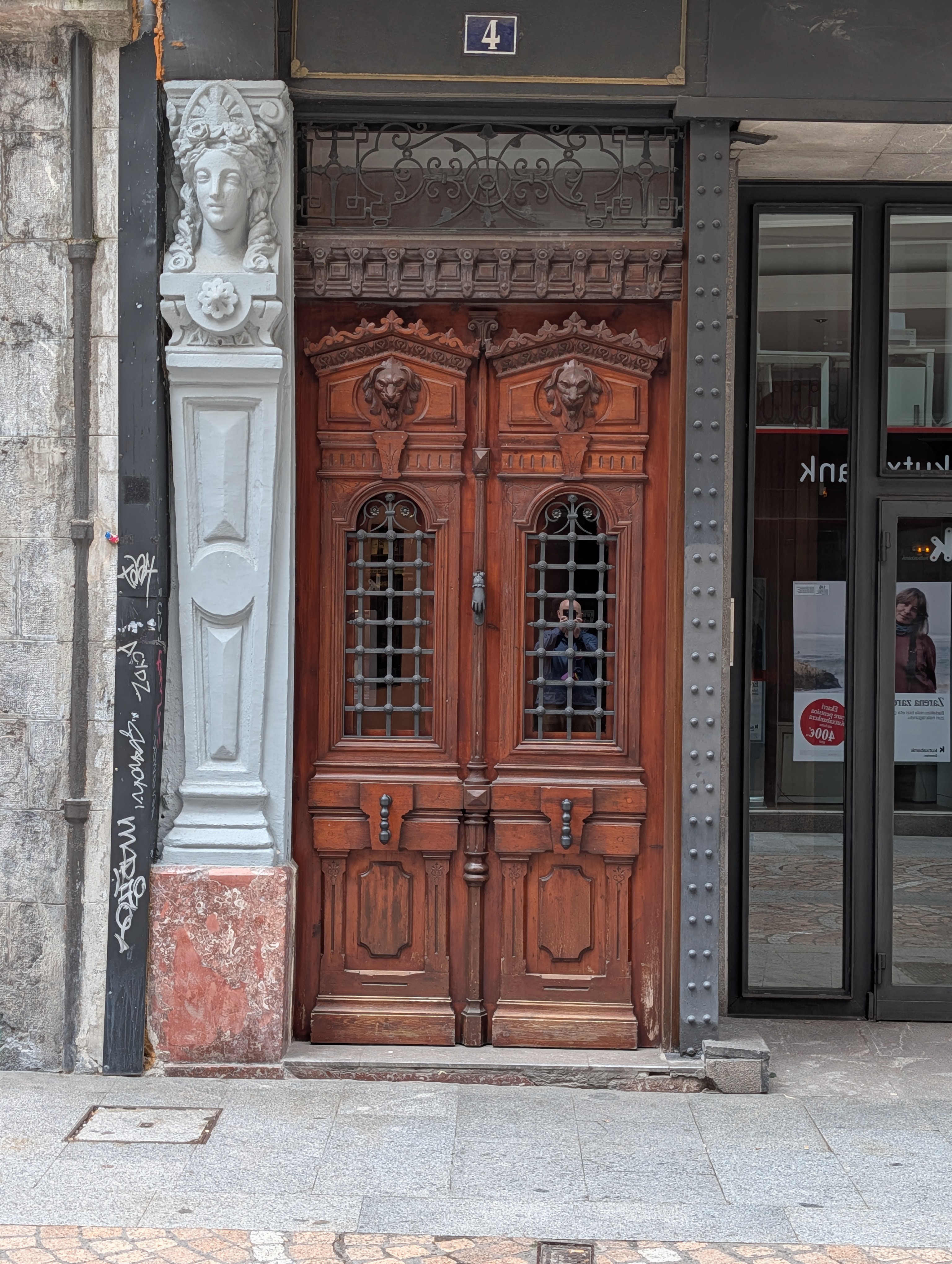 Wooden door with grated windows