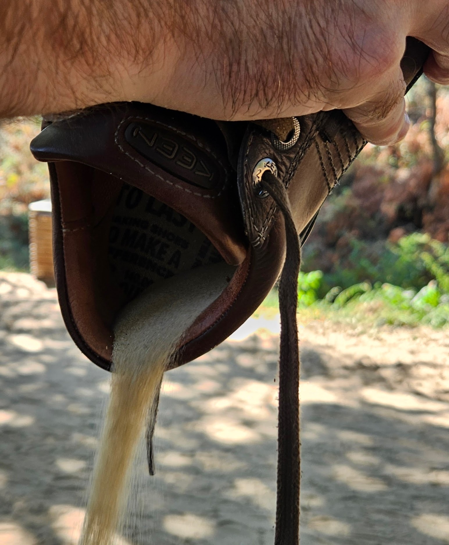 Dumping sand from a shoe