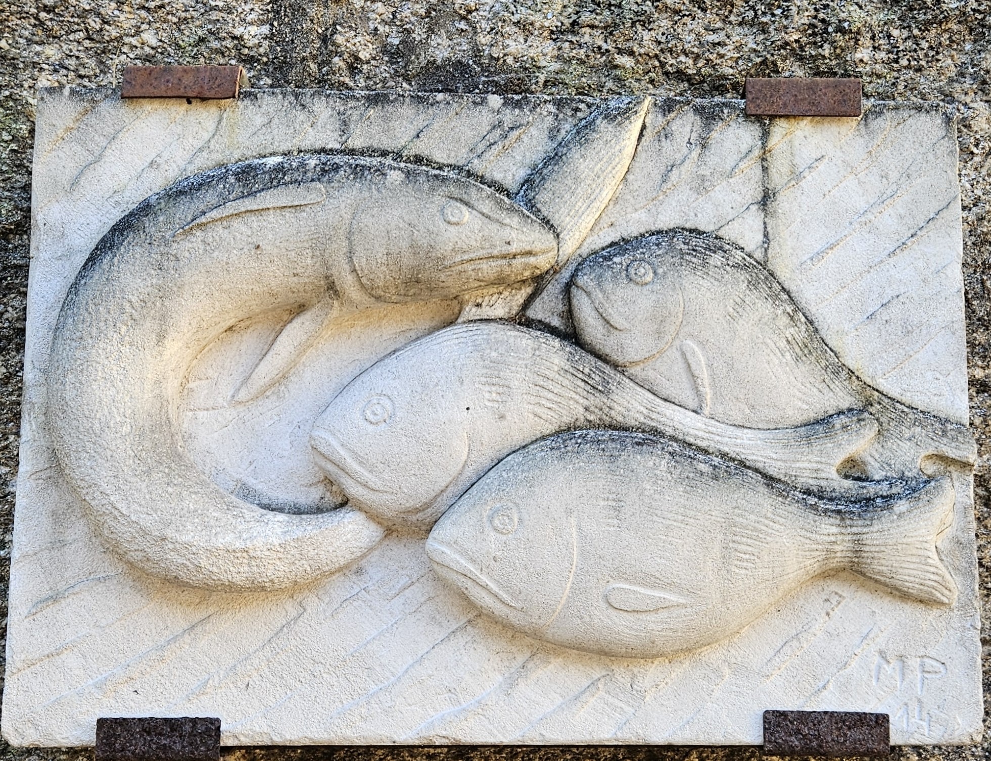 Relief sculpture of fish at the market