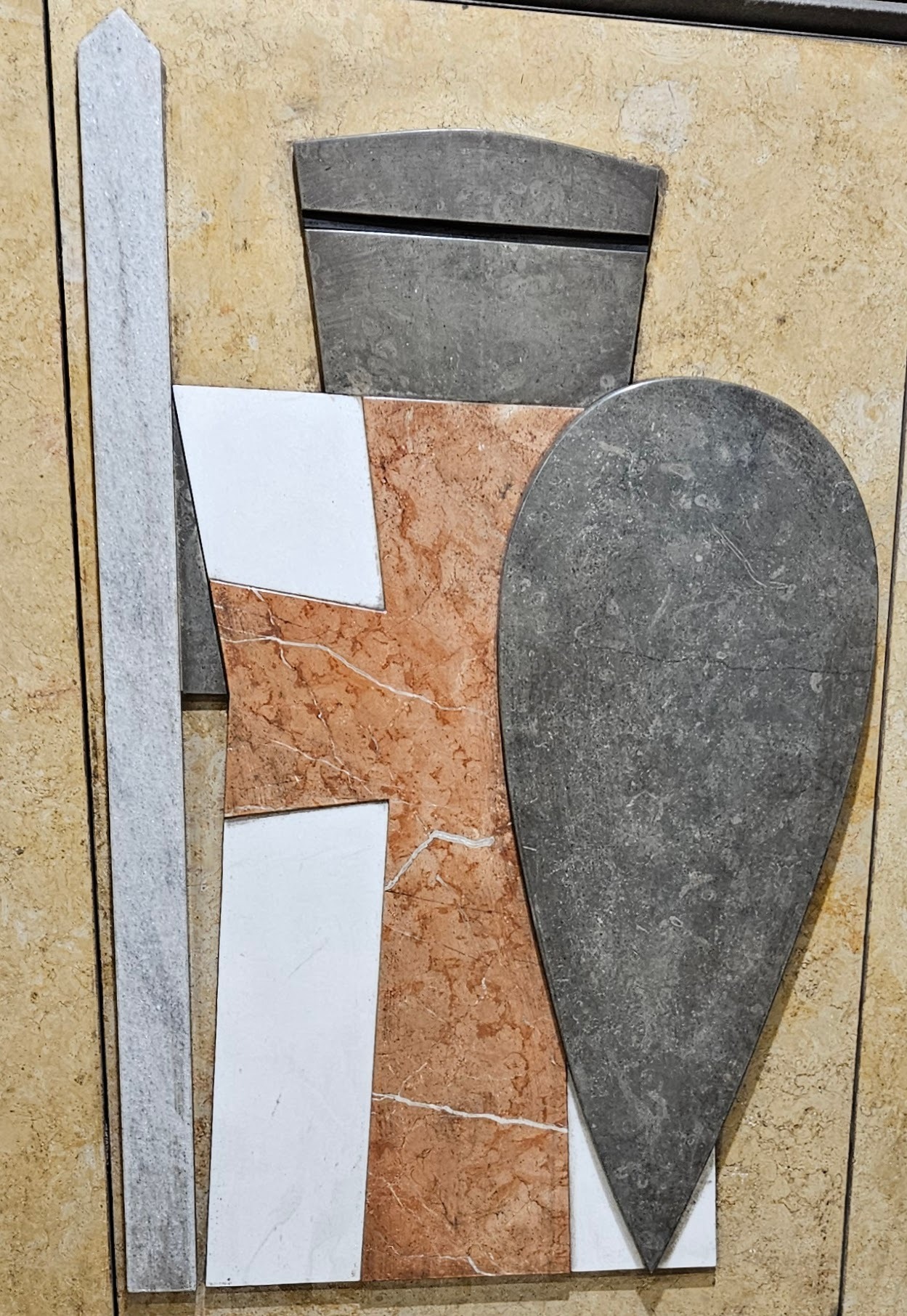 Cut stone mural in Lisbon metro - knight