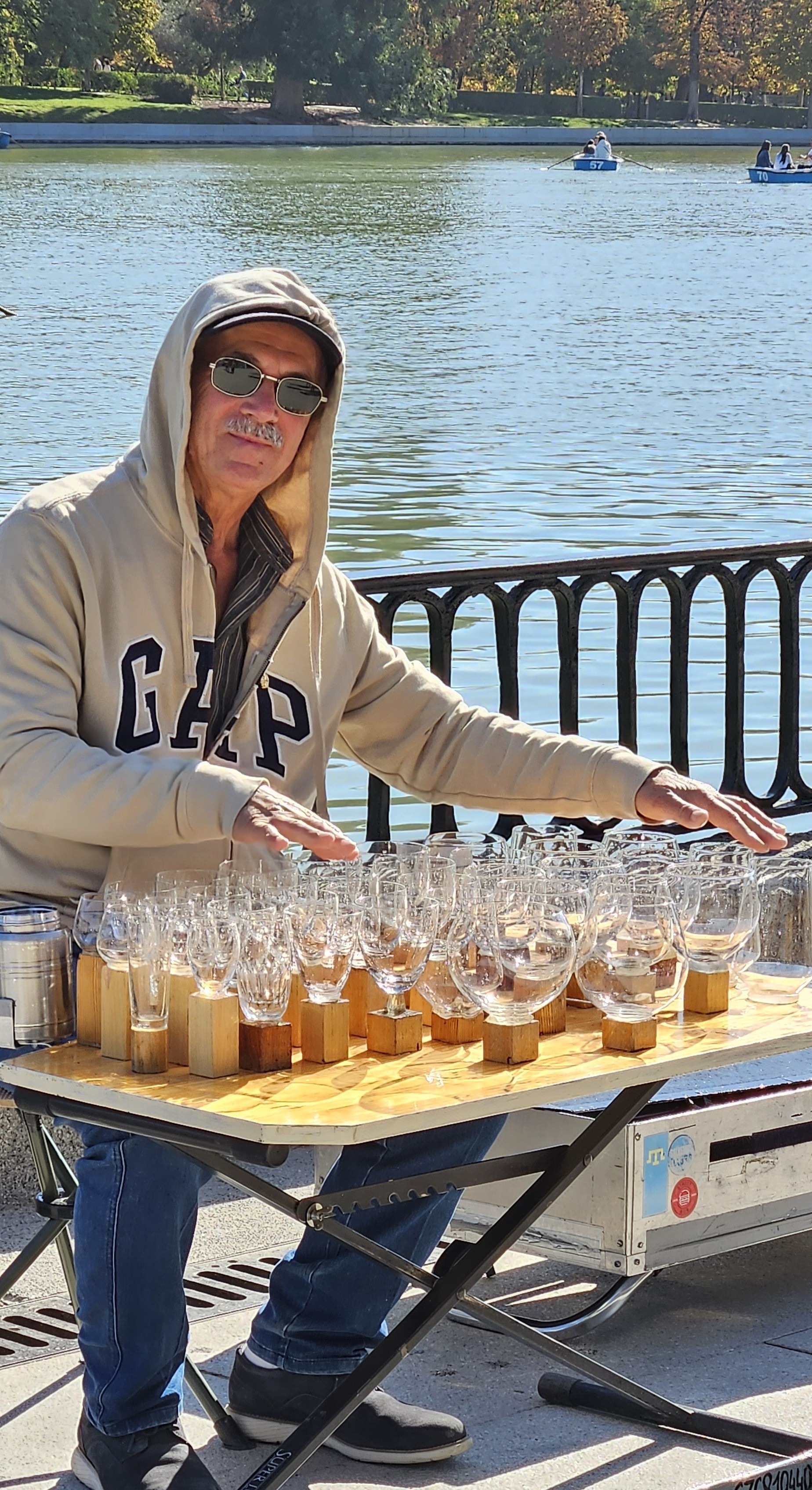Busker playing music on glassware