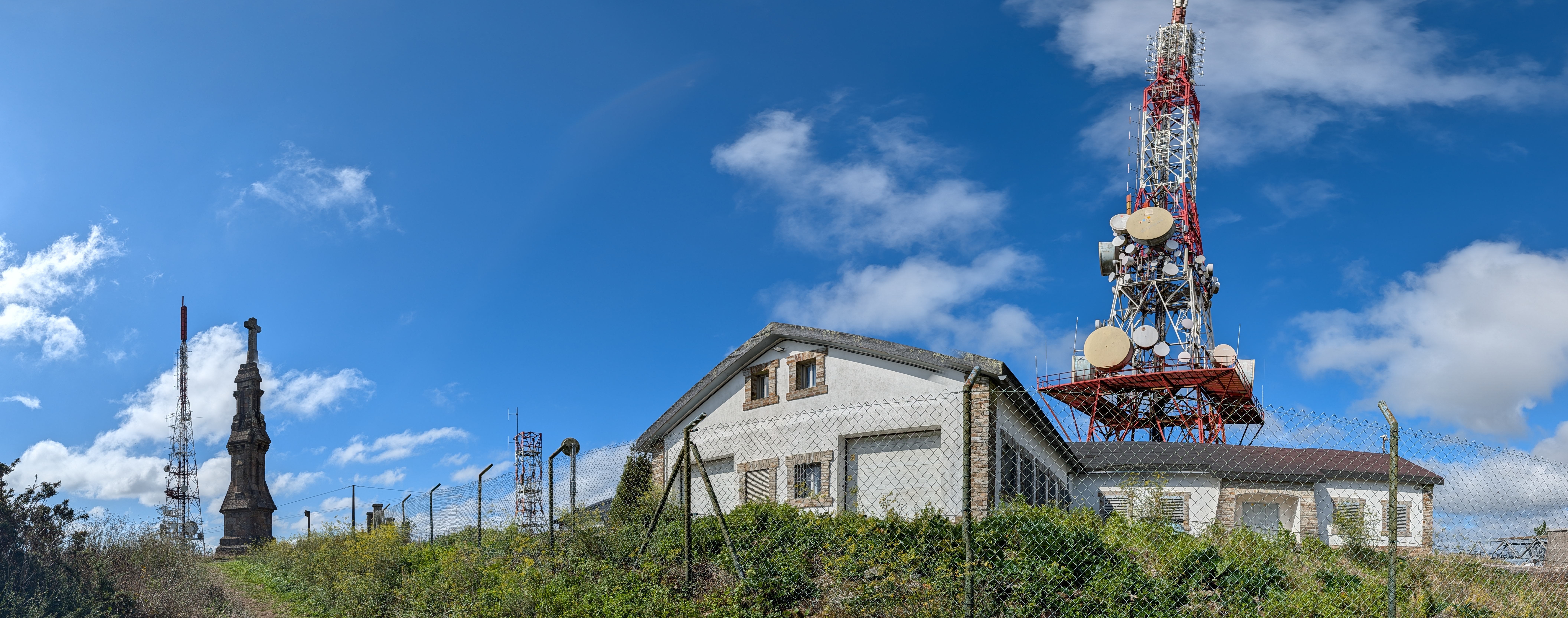 Communications towers and large Christian monument atop Monte Pedroso