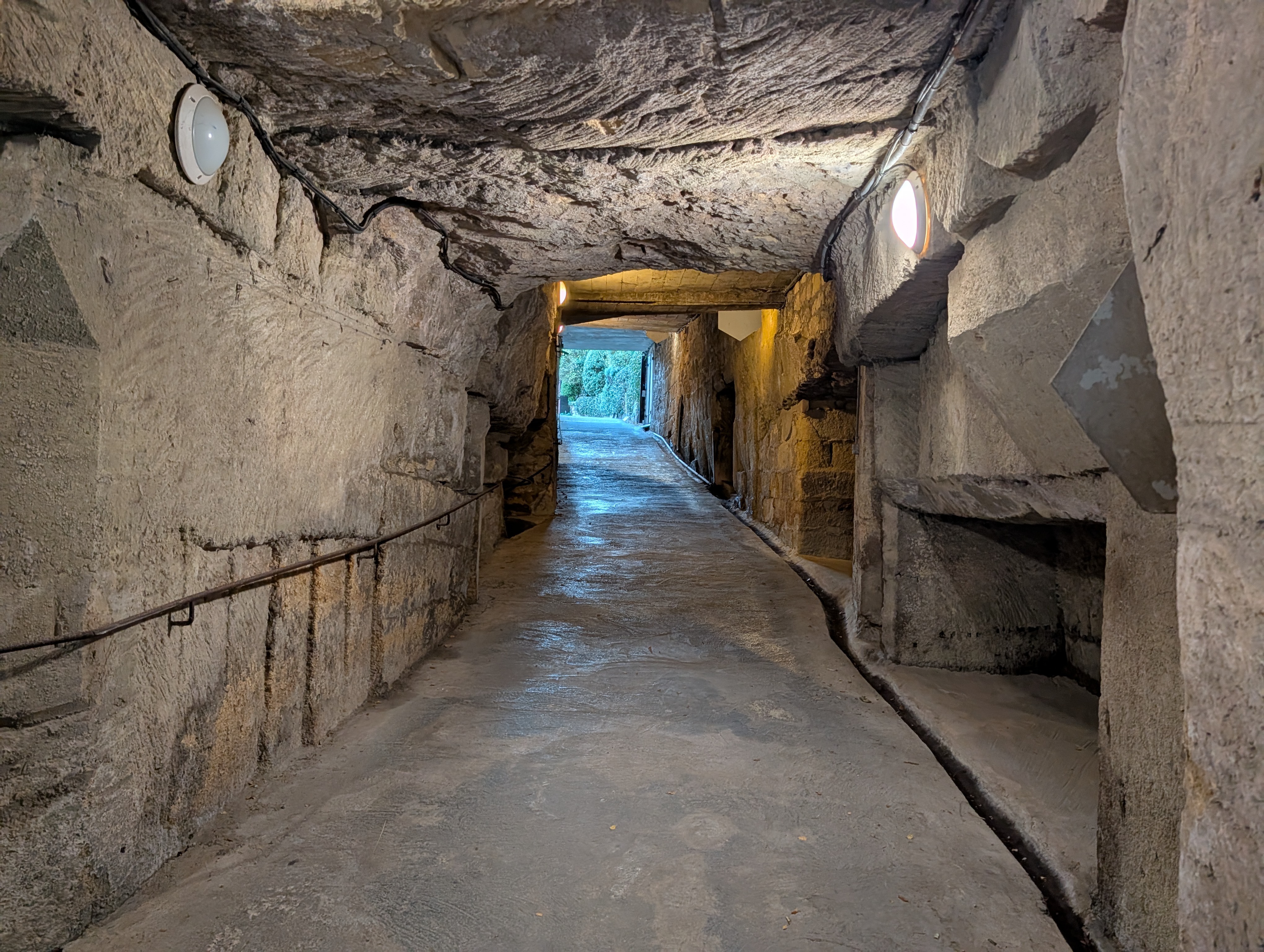 Ramp exiting upward through stone passageway