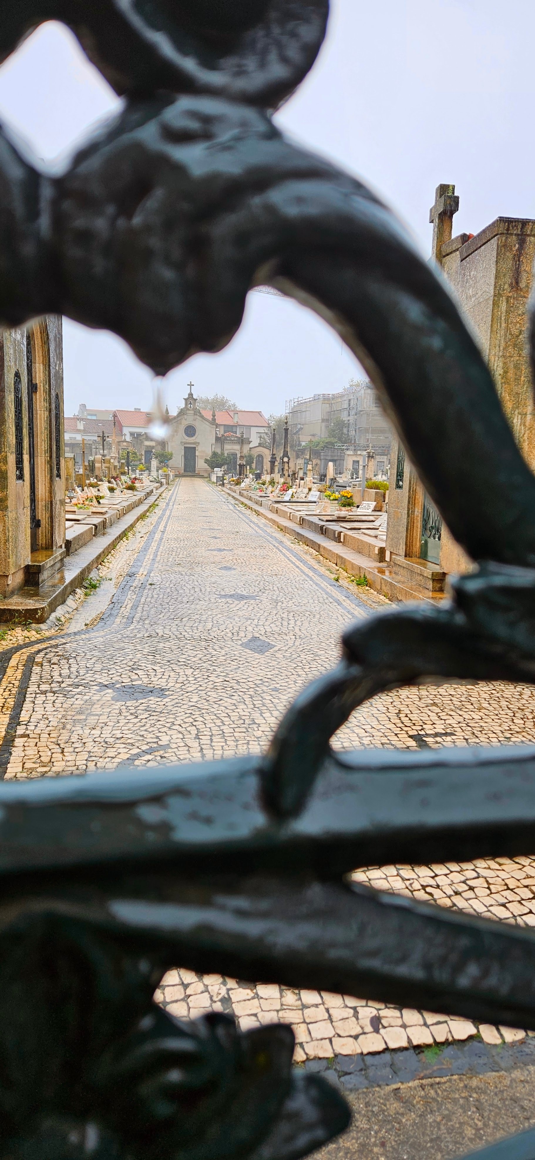 Chapel and cemetery seen through gate in Foz District