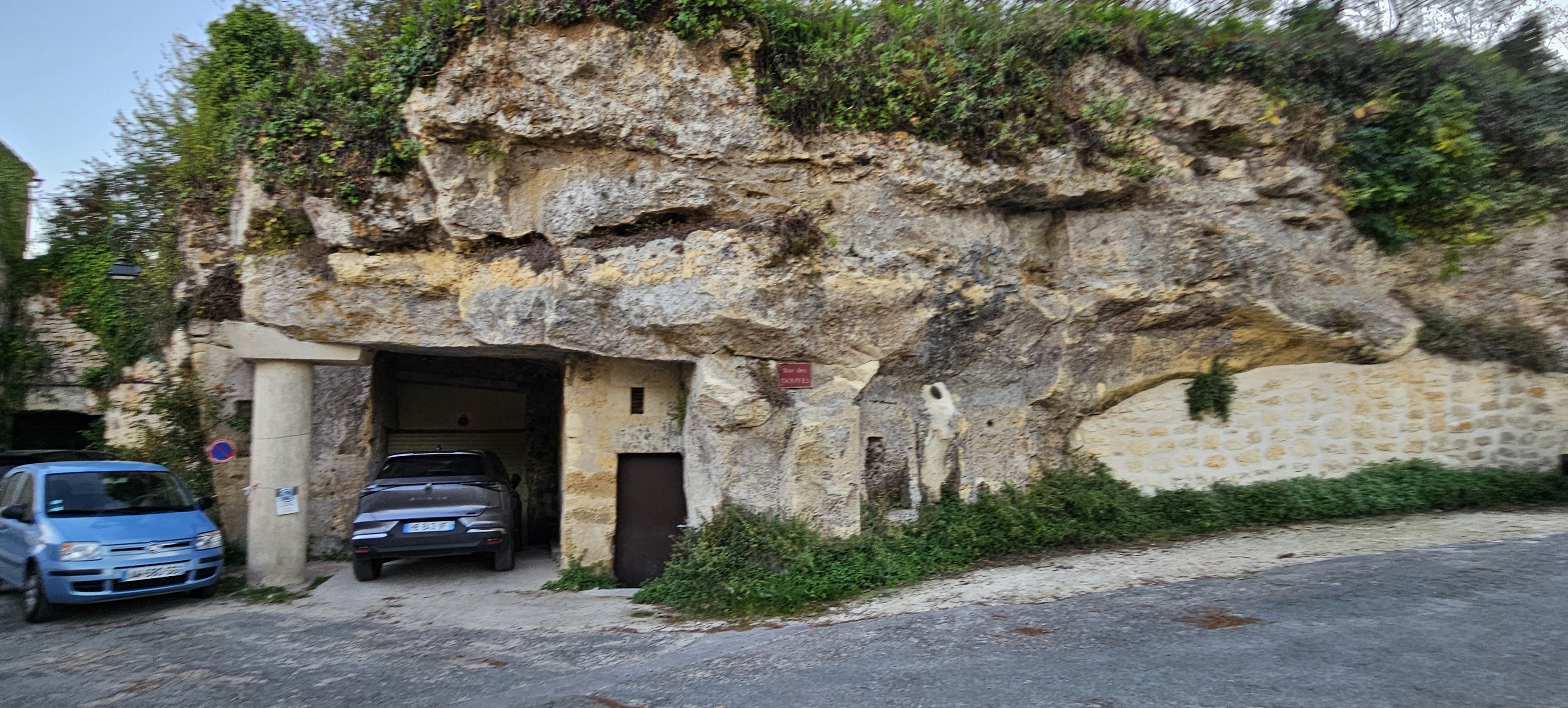Garage carved into stone cliff