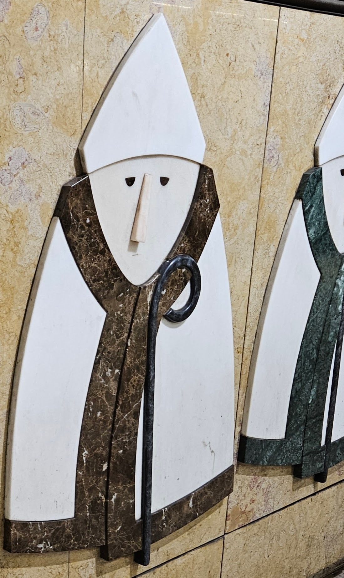 Cut stone mural in Lisbon metro - monk